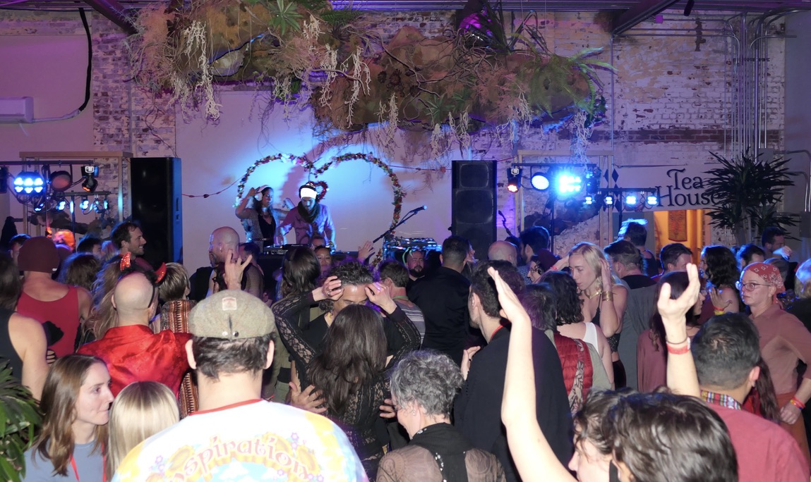 A vibrant community gathering with tea house ambiance