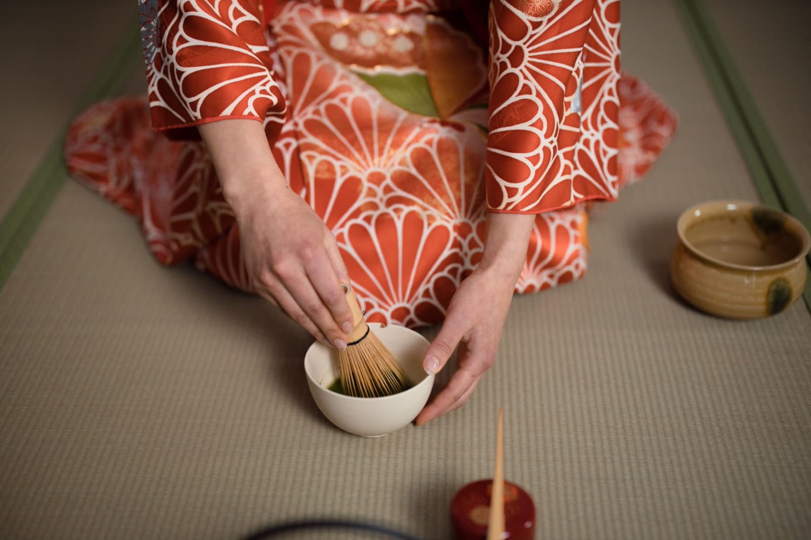 Japanese matcha ceremony — whisking matcha in a bowl