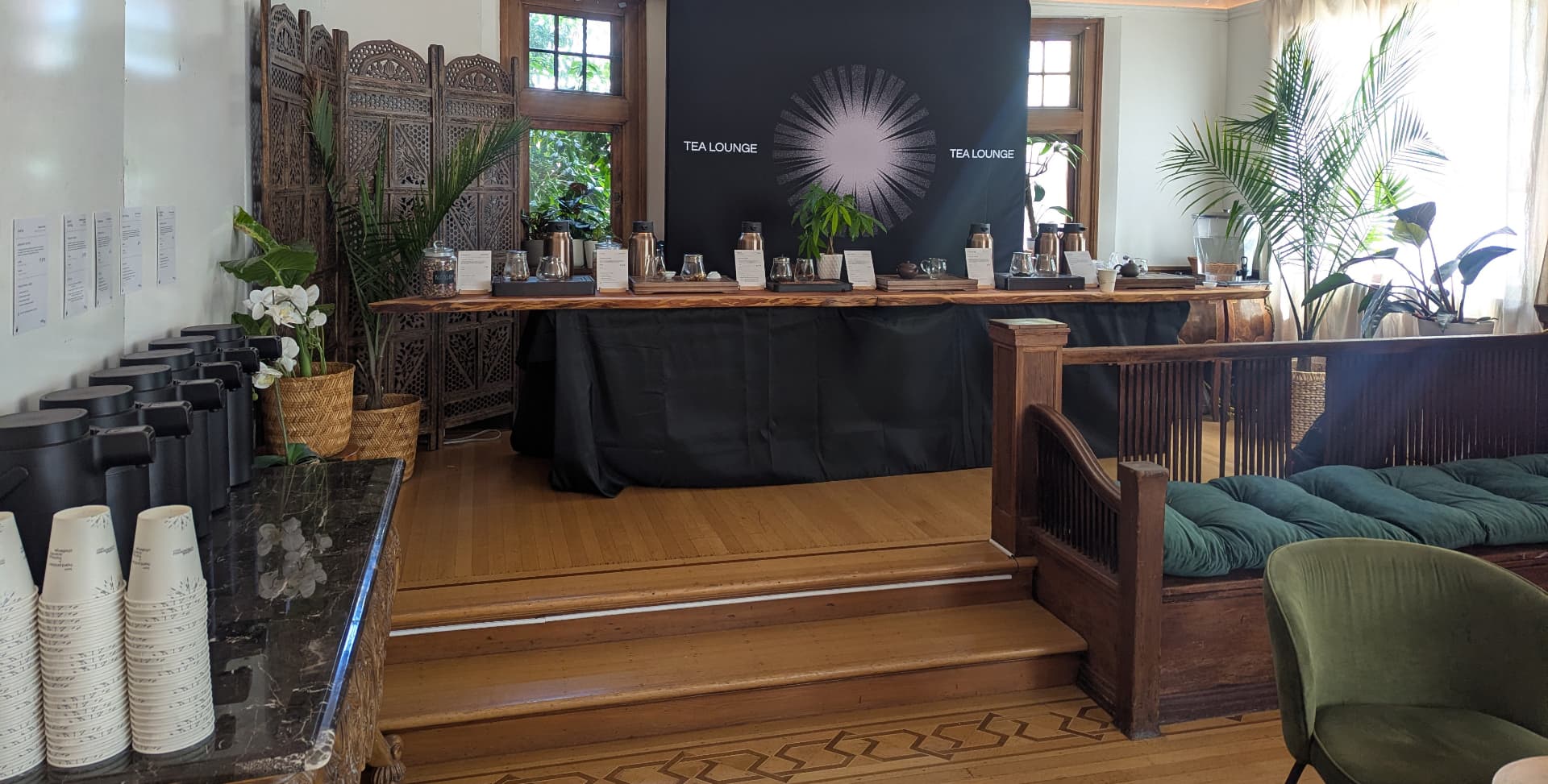 Tea tasting bar with a lineup of gourmet teas and to-go cups